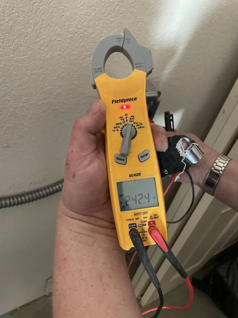 Voltage testing with clamp meter during Electrical Installation Services in Coral Springs